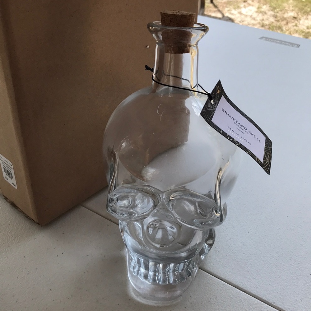 Pottery Barn graveyard skull decanter BN
